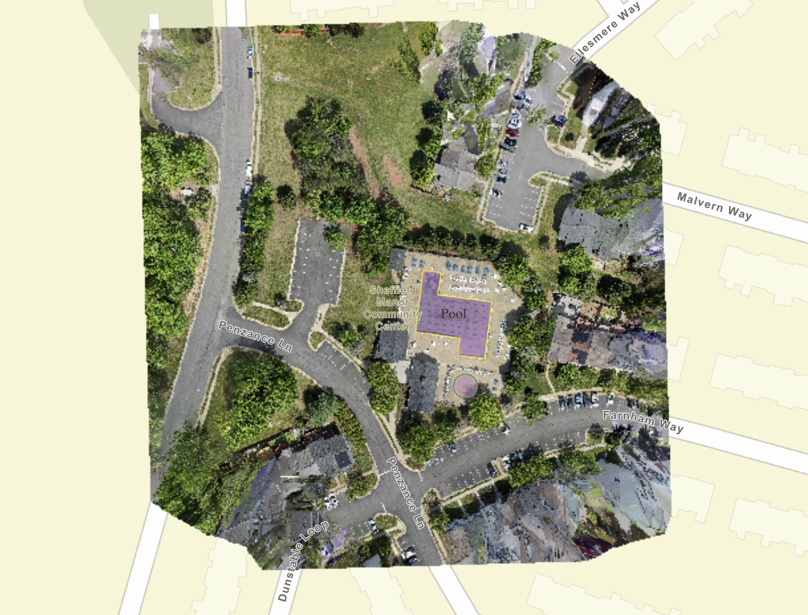 Stitched top-down orthomosaic map of a neighborhood community center, pool and streets with labeled roads and an outlined pool area
